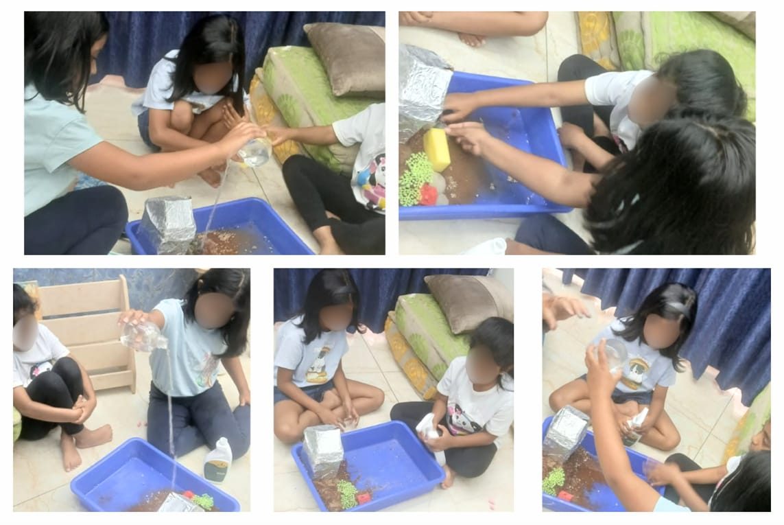 Children water-testing monsoon-proof house models they built