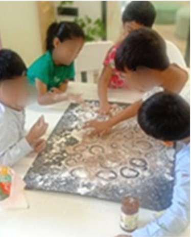 Children working together on a space activity